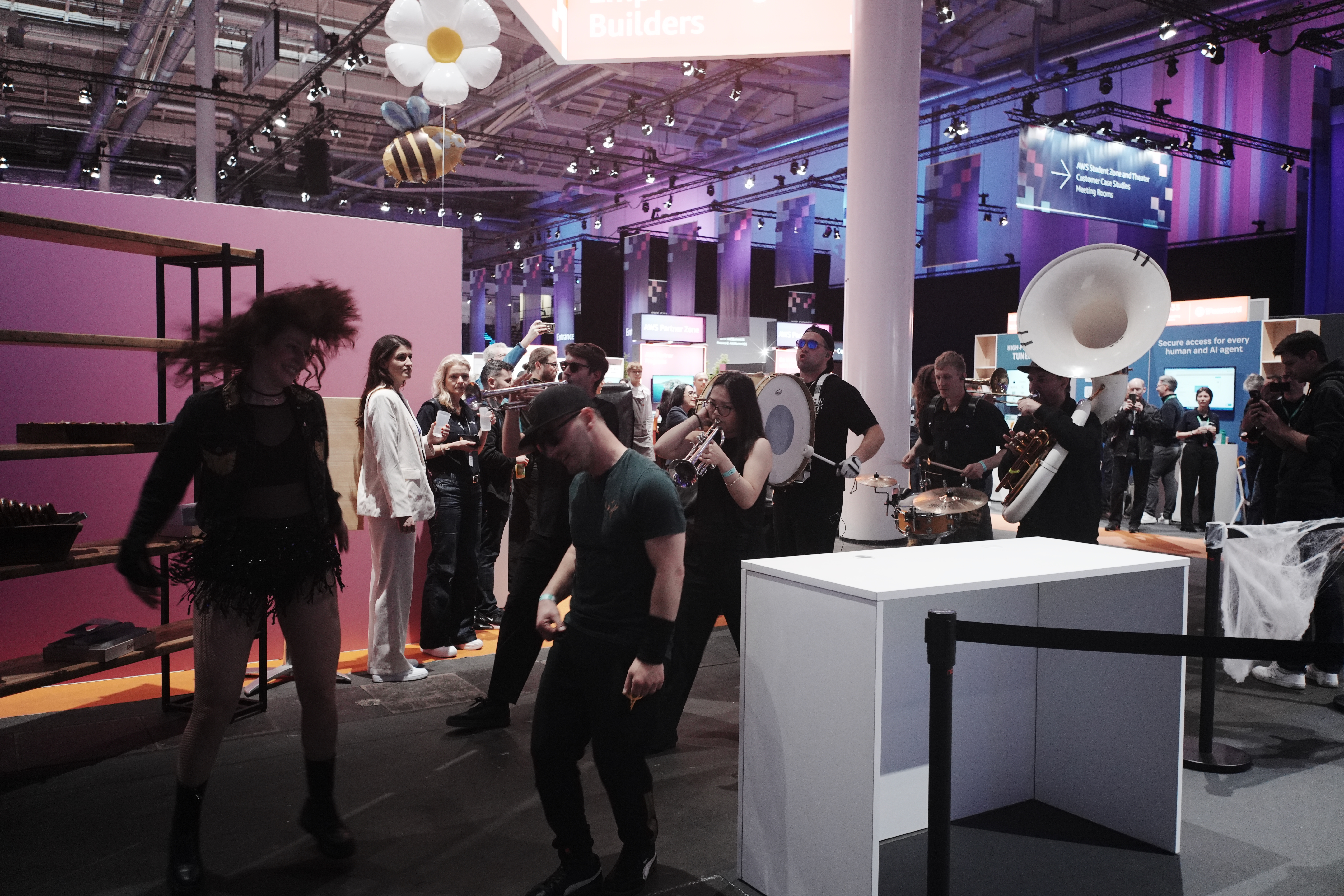 Marching band passing through the expo floor during the talk