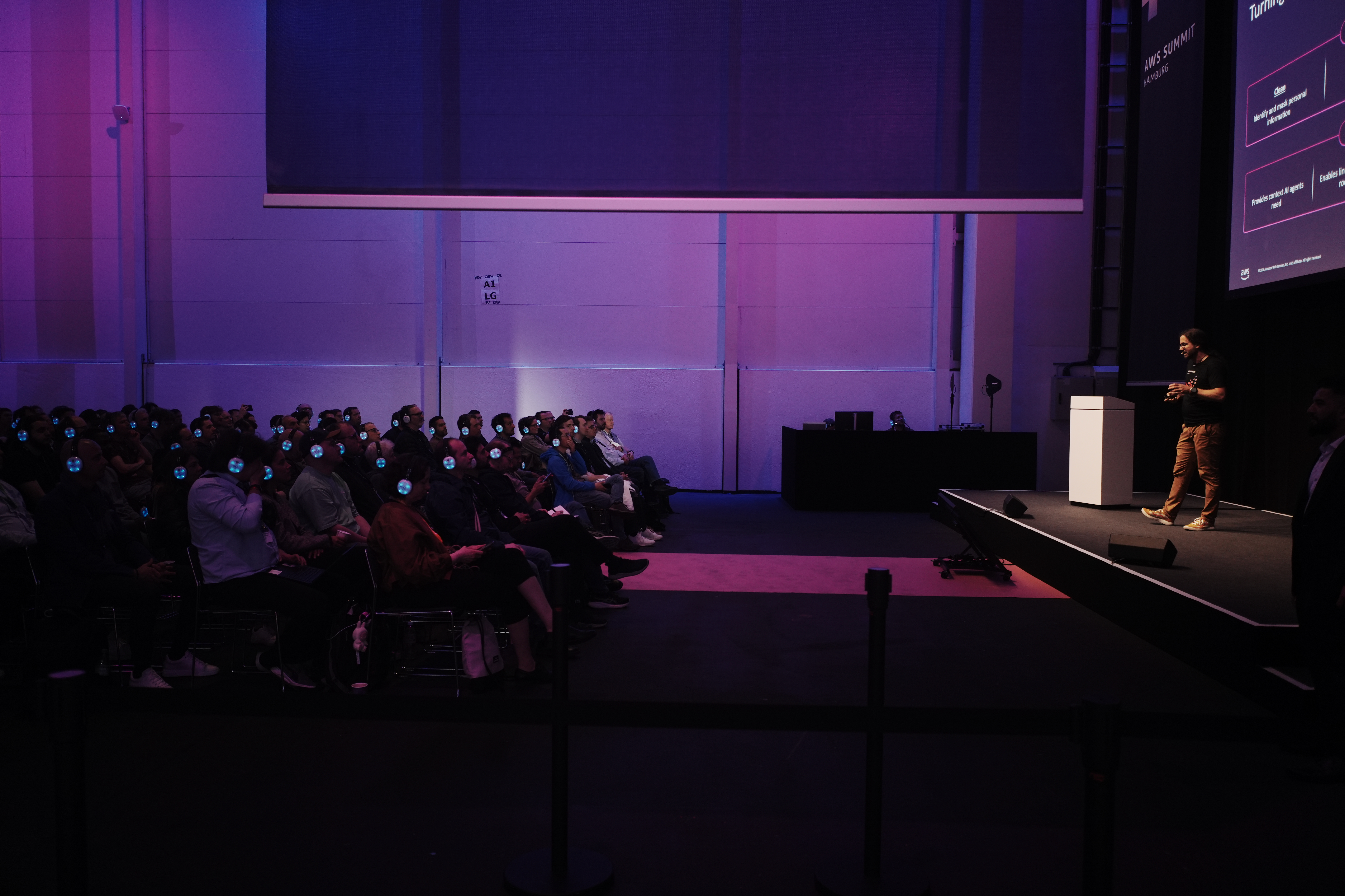 Stefan Christoph on stage presenting AIM201